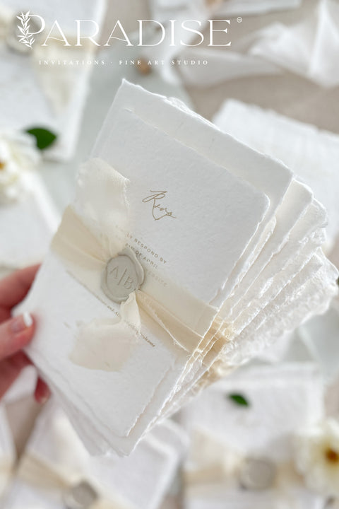 This exquisite wedding invites suite offers a blend of natural elegance and modern sophistication. Printed on luxurious handmade cotton paper in a soft ivory hue, each invitation features a delicate blind embossed floral design. A touch of refined artistry is added with elegant modern calligraphy, creating a truly classy wedding stationery set that beautifully hints at your special day.