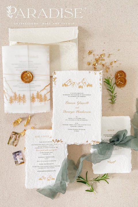Invite your guests to your special day with the perfect blend of natural beauty and refined elegance. These unique mountain invites are printed on luxurious, eco-friendly handmade paper, giving them a rich, organic texture. A delicate golden leaf detail adds a touch of understated luxury, perfectly complementing the rugged charm of a mountain landscape. This rustic chic stationery is ideal for a nature-inspired wedding that is both sophisticated and environmentally conscious.