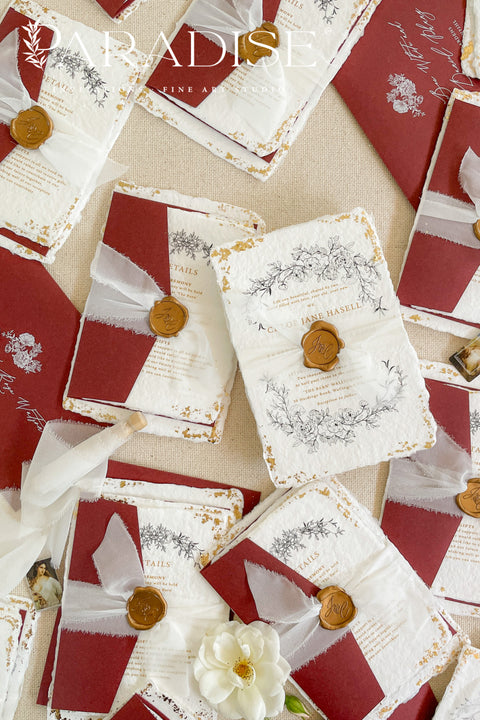 This exquisite wedding invitations suite offers a blend of natural texture and timeless charm. Each invite is printed on luxurious handmade paper with a delicate deckle edge, providing a rich, organic feel. The design is finished with a delicate golden leaf detail, adding a touch of understated elegance and luxury. The result is a truly memorable vintage style stationery set that beautifully hints at your special day.