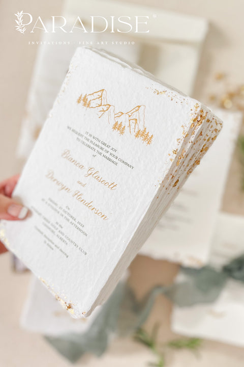 Invite your guests to your special day with the perfect blend of natural beauty and refined elegance. These unique mountain invites are printed on luxurious, eco-friendly handmade paper, giving them a rich, organic texture. A delicate golden leaf detail adds a touch of understated luxury, perfectly complementing the rugged charm of a mountain landscape. This rustic chic stationery is ideal for a nature-inspired wedding that is both sophisticated and environmentally conscious.