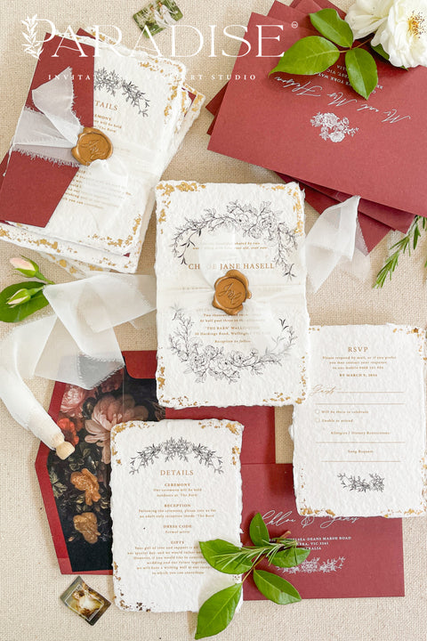 This exquisite wedding invitations suite offers a blend of natural texture and timeless charm. Each invite is printed on luxurious handmade paper with a delicate deckle edge, providing a rich, organic feel. The design is finished with a delicate golden leaf detail, adding a touch of understated elegance and luxury. The result is a truly memorable vintage style stationery set that beautifully hints at your special day.