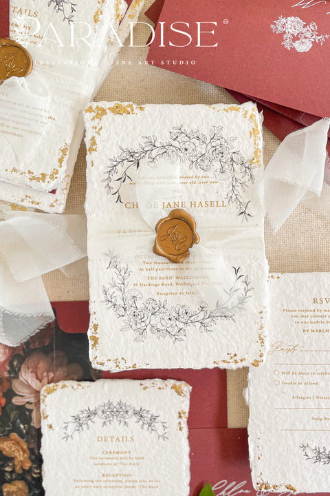 This exquisite wedding invitations suite offers a blend of natural texture and timeless charm. Each invite is printed on luxurious handmade paper with a delicate deckle edge, providing a rich, organic feel. The design is finished with a delicate golden leaf detail, adding a touch of understated elegance and luxury. The result is a truly memorable vintage style stationery set that beautifully hints at your special day.