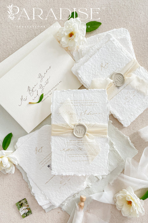 This exquisite wedding invites suite offers a blend of natural elegance and modern sophistication. Printed on luxurious handmade cotton paper in a soft ivory hue, each invitation features a delicate blind embossed floral design. A touch of refined artistry is added with elegant modern calligraphy, creating a truly classy wedding stationery set that beautifully hints at your special day.