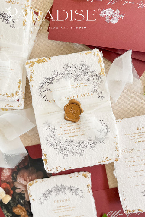 This exquisite wedding invitations suite offers a blend of natural texture and timeless charm. Each invite is printed on luxurious handmade paper with a delicate deckle edge, providing a rich, organic feel. The design is finished with a delicate golden leaf detail, adding a touch of understated elegance and luxury. The result is a truly memorable vintage style stationery set that beautifully hints at your special day.