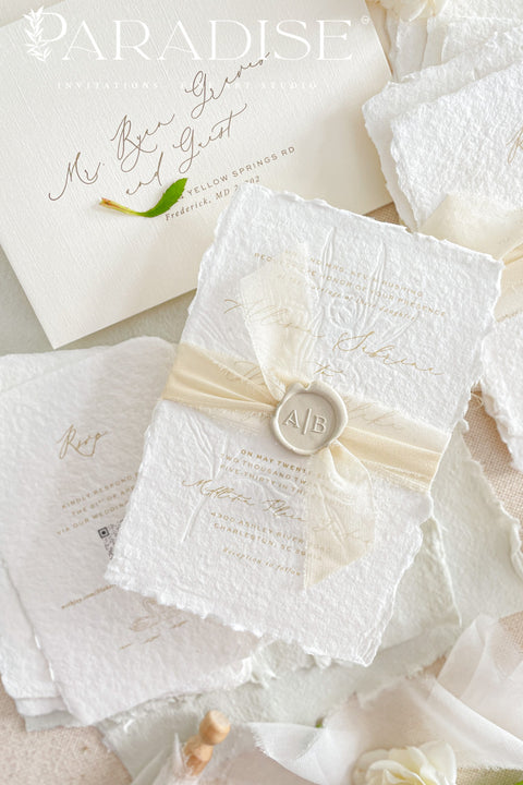 This exquisite wedding invites suite offers a blend of natural elegance and modern sophistication. Printed on luxurious handmade cotton paper in a soft ivory hue, each invitation features a delicate blind embossed floral design. A touch of refined artistry is added with elegant modern calligraphy, creating a truly classy wedding stationery set that beautifully hints at your special day.