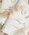 Luxury handmade paper wedding vows booklet featuring deckled edge cotton paper, elegant typography, chiffon ribbon ties, and wax seal accents.