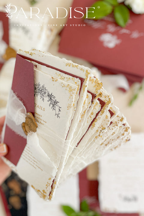 This exquisite wedding invitations suite offers a blend of natural texture and timeless charm. Each invite is printed on luxurious handmade paper with a delicate deckle edge, providing a rich, organic feel. The design is finished with a delicate golden leaf detail, adding a touch of understated elegance and luxury. The result is a truly memorable vintage style stationery set that beautifully hints at your special day.