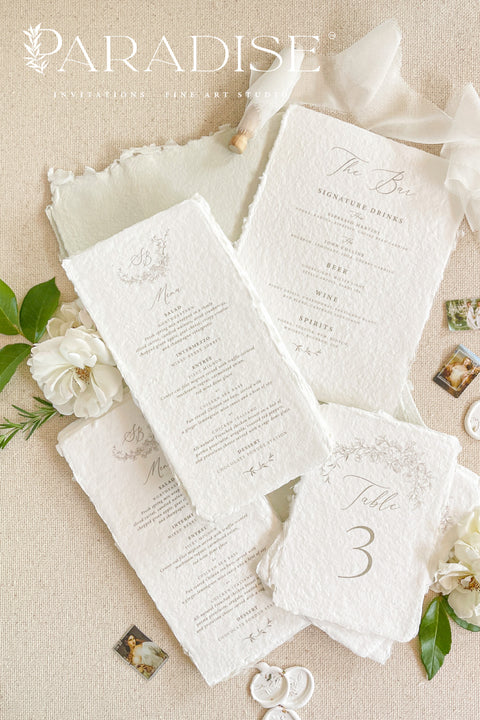 Bring timeless refinement to your celebration with our handmade paper wedding menus, beautifully complemented by matching table numbers and bar signs. Each piece is crafted from 100% cotton rag paper with naturally torn deckled edges, exuding fine art elegance and artisanal charm. The soft texture, delicate typography, and minimal botanical details create a cohesive and luxurious table presentation. Perfect for romantic, garden, or fine art weddings, these menus seamlessly blend style and craftsmanship.