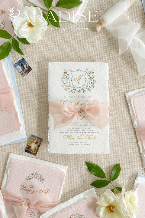 Announce your love story with timeless artistry through our handmade watercolor floral crest wedding invitations, where classic design meets modern elegance. Each invitation is crafted by hand and features a beautifully painted watercolor crest of delicate florals, personalized with your initials - a true symbol of your union.