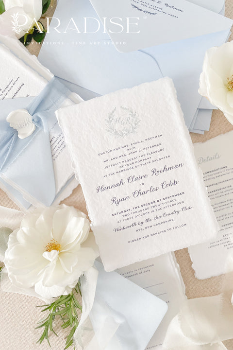 Delicate, refined, and beautifully personal - our handmade wedding invitations with a monogram crest are designed to capture the essence of timeless romance. Printed on luxury cotton paper with soft deckled edges, made entirely by hand and tied with a light blue silk ribbon for a graceful finishing touch. The custom monogram crest adds an elegant and personal element, making every suite unique to you and your story.