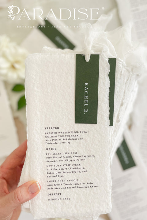 Refined, timeless, and effortlessly elegant - our handmade paper wedding menus are the perfect addition to any fine art table setting. Each menu is crafted from 100% cotton rag paper, featuring soft deckled edges and a personalized name tag in deep forest green tones for a modern botanical touch. Finished with delicate silk ribbon detailing, these menus bring sophistication and cohesion to your event design.