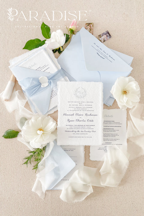 Delicate, refined, and beautifully personal - our handmade wedding invitations with a monogram crest are designed to capture the essence of timeless romance. Printed on luxury cotton paper with soft deckled edges, made entirely by hand and tied with a light blue silk ribbon for a graceful finishing touch. The custom monogram crest adds an elegant and personal element, making every suite unique to you and your story.