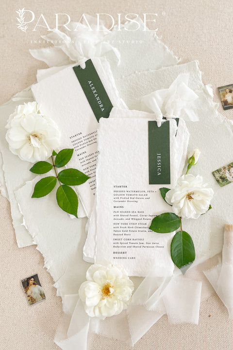 Refined, timeless, and effortlessly elegant - our handmade paper wedding menus are the perfect addition to any fine art table setting. Each menu is crafted from 100% cotton rag paper, featuring soft deckled edges and a personalized name tag in deep forest green tones for a modern botanical touch. Finished with delicate silk ribbon detailing, these menus bring sophistication and cohesion to your event design.