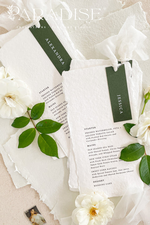 Refined, timeless, and effortlessly elegant - our handmade paper wedding menus are the perfect addition to any fine art table setting. Each menu is crafted from 100% cotton rag paper, featuring soft deckled edges and a personalized name tag in deep forest green tones for a modern botanical touch. Finished with delicate silk ribbon detailing, these menus bring sophistication and cohesion to your event design.