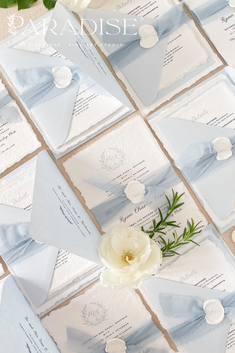 Delicate, refined, and beautifully personal - our handmade wedding invitations with a monogram crest are designed to capture the essence of timeless romance. Printed on luxury cotton paper with soft deckled edges, made entirely by hand and tied with a light blue silk ribbon for a graceful finishing touch. The custom monogram crest adds an elegant and personal element, making every suite unique to you and your story.