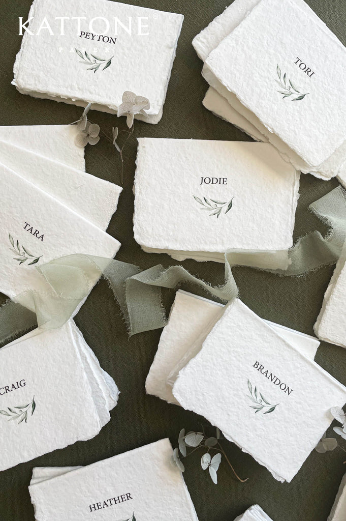 Stack of personalized place cards showcasing consistent design and handcrafted quality.