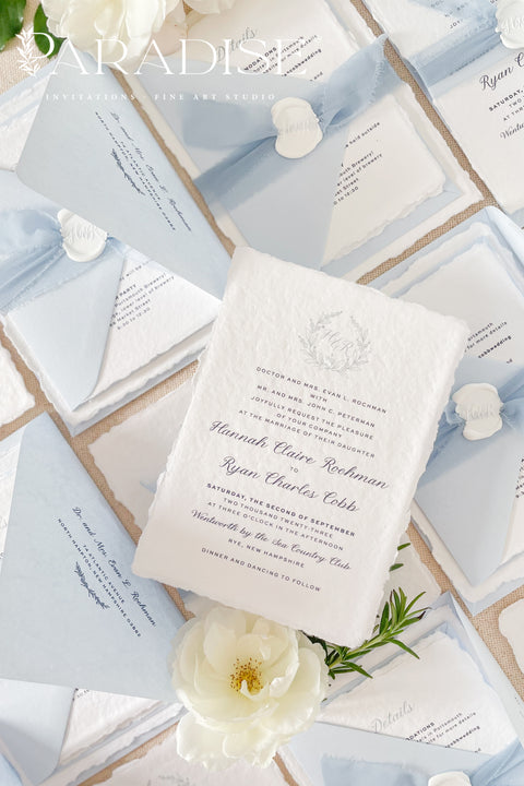 Delicate, refined, and beautifully personal - our handmade wedding invitations with a monogram crest are designed to capture the essence of timeless romance. Printed on luxury cotton paper with soft deckled edges, made entirely by hand and tied with a light blue silk ribbon for a graceful finishing touch. The custom monogram crest adds an elegant and personal element, making every suite unique to you and your story.