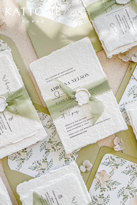 This exquisite wedding invitations suite offers a blend of natural elegance and modern sophistication. Perfect for a garden green wedding, these beautiful invites feature a chic, contemporary design printed on luxurious handmade cotton paper. The suite includes a beautifully designed wedding timeline, guiding your guests through your special day with a personal and artistic touch, all wrapped in a fresh and modern aesthetic.