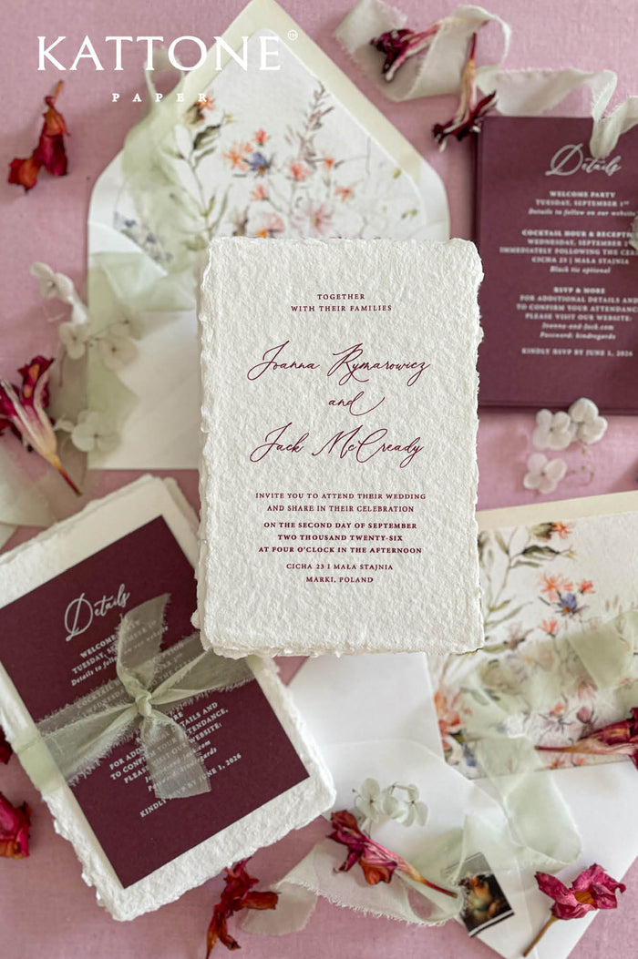 Luxury handmade cotton paper wedding invitation with deckled edges styled with burgundy details cards, sage silk ribbon and botanical watercolor envelope liners.