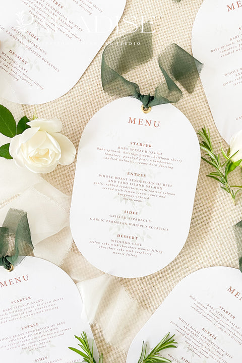 Make a refined statement at your reception with our double arch wedding menus, a modern take on classic elegance. These menus feature a unique double-arched silhouette, expertly printed on luxury thick cardstock for a soft yet structured feel. The minimalist layout highlights elegant typography in warm, contemporary tones, while a silk chiffon ribbon and gold grommet detail add a sophisticated finishing touch.