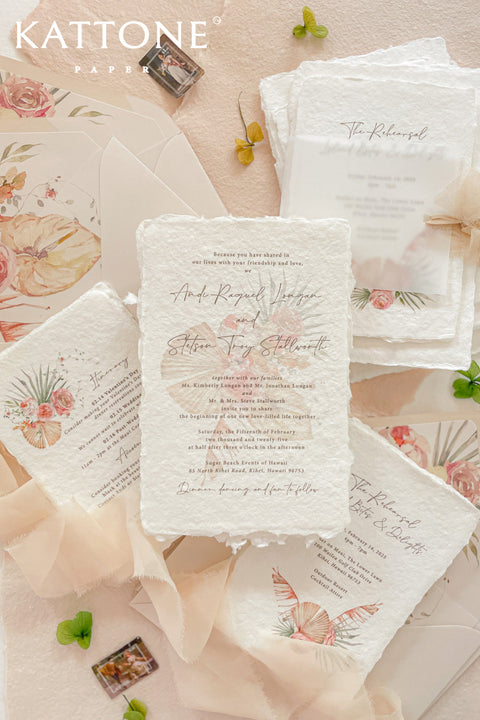 Announce your wedding with this handmade paper wedding invitation suite is a celebration of love and artistry. Each piece is printed on luxury deckled-edge cotton paper, known for its delicate texture and organic edges that make every card one of a kind. Adorned with watercolor floral illustrations in warm blush and peach tones, the design captures a sense of effortless elegance and sun-kissed beauty.