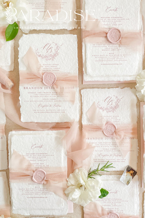 This exquisite wedding invitations suite offers a perfect blend of natural texture and personalized elegance. Each invite is a beautiful work of art, featuring a delicate floral invites design and a custom monogram created just for you. Printed on luxurious handmade paper with a romantic deckle edge, these pretty invites are a tactile and beautiful preview of your special day.