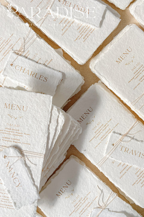 Bring timeless elegance to your table with our handmade paper wedding menus, crafted from 100% cotton rag paper and finished with natural deckled edges for a romantic fine-art touch. Featuring minimalist typography, warm neutral tones, and custom guest name tags tied with natural twine, these menus are the perfect blend of sophistication and organic charm. Each piece is designed to elevate your event’s presentation - ideal for weddings, rehearsal dinners, elopements, and styled shoots.
