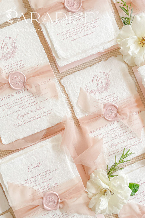 This exquisite wedding invitations suite offers a perfect blend of natural texture and personalized elegance. Each invite is a beautiful work of art, featuring a delicate floral invites design and a custom monogram created just for you. Printed on luxurious handmade paper with a romantic deckle edge, these pretty invites are a tactile and beautiful preview of your special day.
