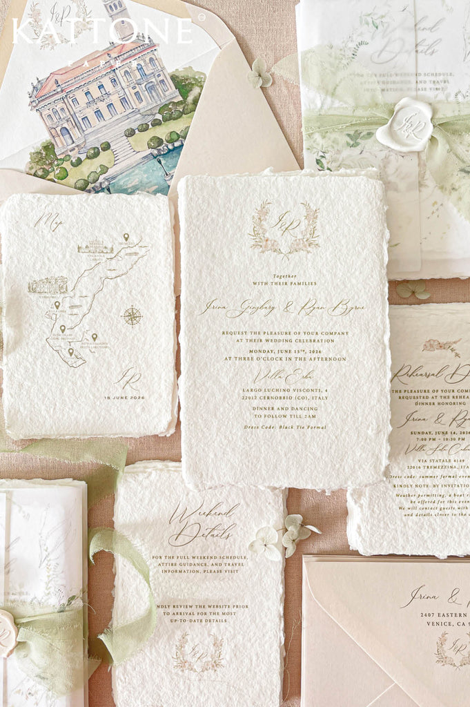 Premium handmade wedding invitation suite with custom venue artwork, deckled edge cotton paper, vellum wraps, wax seal accents, and elegant botanical styling for luxury destination weddings.