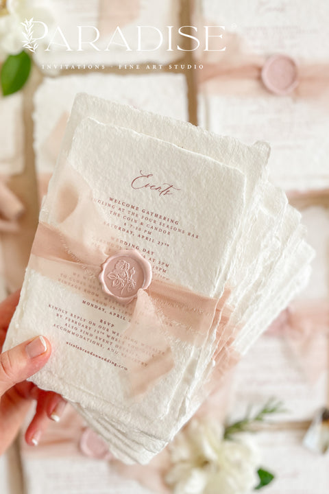 This exquisite wedding invitations suite offers a perfect blend of natural texture and personalized elegance. Each invite is a beautiful work of art, featuring a delicate floral invites design and a custom monogram created just for you. Printed on luxurious handmade paper with a romantic deckle edge, these pretty invites are a tactile and beautiful preview of your special day.