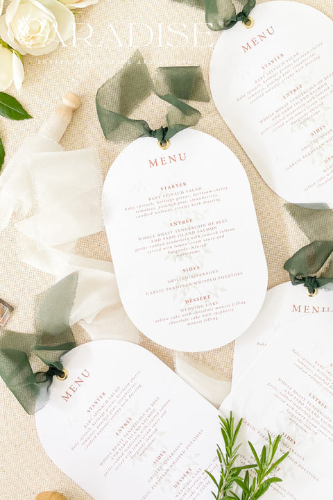 Make a refined statement at your reception with our double arch wedding menus, a modern take on classic elegance. These menus feature a unique double-arched silhouette, expertly printed on luxury thick cardstock for a soft yet structured feel. The minimalist layout highlights elegant typography in warm, contemporary tones, while a silk chiffon ribbon and gold grommet detail add a sophisticated finishing touch.