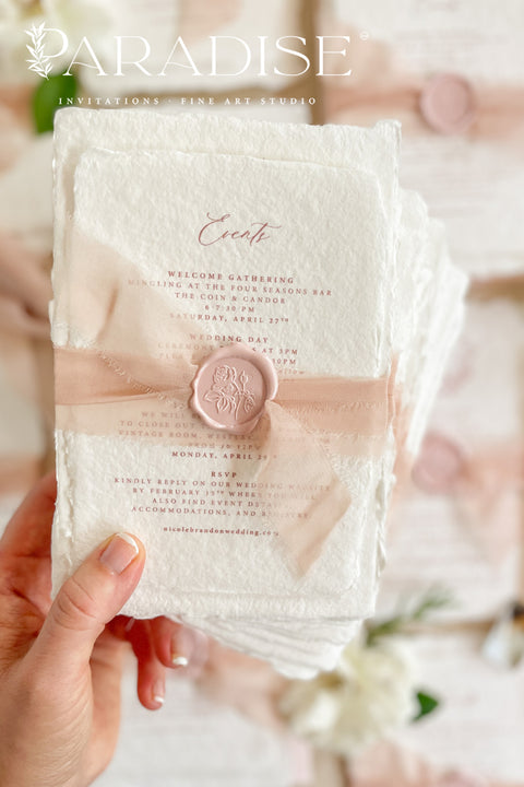 This exquisite wedding invitations suite offers a perfect blend of natural texture and personalized elegance. Each invite is a beautiful work of art, featuring a delicate floral invites design and a custom monogram created just for you. Printed on luxurious handmade paper with a romantic deckle edge, these pretty invites are a tactile and beautiful preview of your special day.