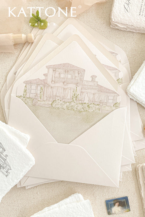 Close-up of watercolor venue illustration printed on envelope liner, showing architectural details, soft washes, and refined paper texture.