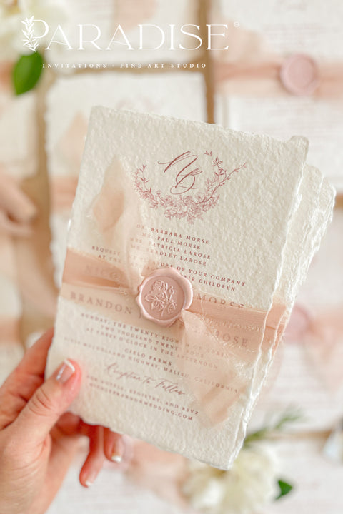 This exquisite wedding invitations suite offers a perfect blend of natural texture and personalized elegance. Each invite is a beautiful work of art, featuring a delicate floral invites design and a custom monogram created just for you. Printed on luxurious handmade paper with a romantic deckle edge, these pretty invites are a tactile and beautiful preview of your special day.