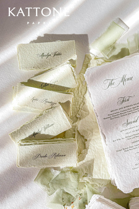 Bring artisanal beauty to your event with our handmade paper place cards, crafted from luxurious cotton rag paper and detailed with natural deckled edges. Each card features a pressed dried floral element sealed beneath a creamy wax stamp, creating a textured fine-art look perfect for garden weddings, outdoor celebrations, and romantic gatherings. These one-of-a-kind place cards add organic charm, timeless artistry, and meaningful detail to every tablescape.