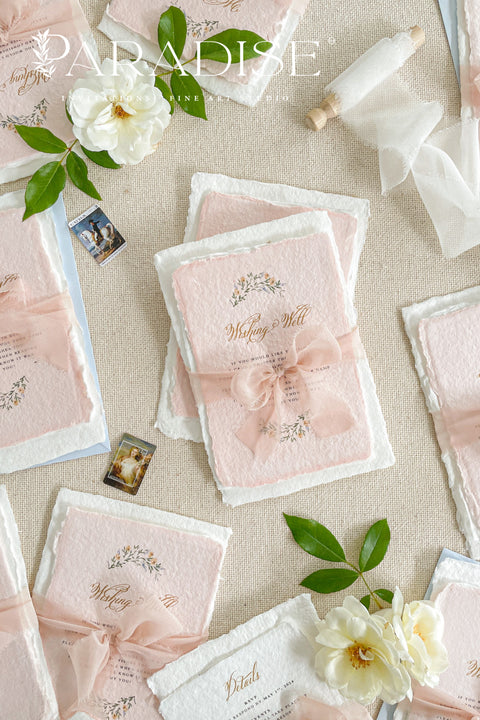 Announce your love story with timeless artistry through our handmade watercolor floral crest wedding invitations, where classic design meets modern elegance. Each invitation is crafted by hand and features a beautifully painted watercolor crest of delicate florals, personalized with your initials - a true symbol of your union.