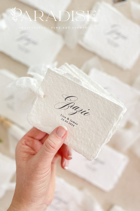 Add refined romance to your event with our handmade paper place cards, crafted from luxurious cotton rag paper and finished with softly torn deckled edges. Each card features elegant calligraphy and a hand-tied chiffon ribbon, creating a dreamy fine-art aesthetic perfect for weddings, bridal showers, rehearsal dinners, and upscale celebrations. Designed to elevate your tablescape, these artisan place cards bring texture, movement, and timeless charm to every setting.