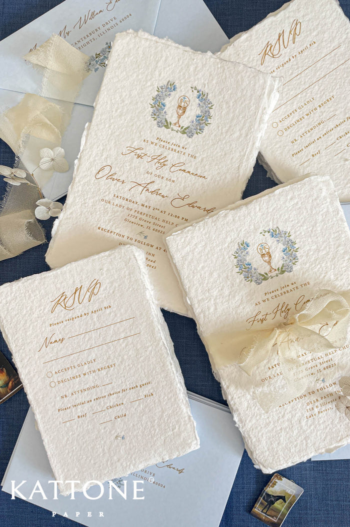 First Holy Communion invitation printed on handmade cotton paper with chalice symbol and blue floral wreath.