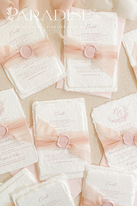 This exquisite wedding invitations suite offers a perfect blend of natural texture and personalized elegance. Each invite is a beautiful work of art, featuring a delicate floral invites design and a custom monogram created just for you. Printed on luxurious handmade paper with a romantic deckle edge, these pretty invites are a tactile and beautiful preview of your special day.