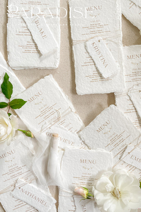 Bring timeless elegance to your table with our handmade paper wedding menus, crafted from 100% cotton rag paper and finished with natural deckled edges for a romantic fine-art touch. Featuring minimalist typography, warm neutral tones, and custom guest name tags tied with natural twine, these menus are the perfect blend of sophistication and organic charm. Each piece is designed to elevate your event’s presentation - ideal for weddings, rehearsal dinners, elopements, and styled shoots.