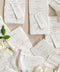 Bring timeless elegance to your table with our handmade paper wedding menus, crafted from 100% cotton rag paper and finished with natural deckled edges for a romantic fine-art touch. Featuring minimalist typography, warm neutral tones, and custom guest name tags tied with natural twine, these menus are the perfect blend of sophistication and organic charm. Each piece is designed to elevate your event’s presentation - ideal for weddings, rehearsal dinners, elopements, and styled shoots.