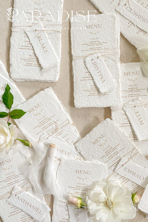 Bring timeless elegance to your table with our handmade paper wedding menus, crafted from 100% cotton rag paper and finished with natural deckled edges for a romantic fine-art touch. Featuring minimalist typography, warm neutral tones, and custom guest name tags tied with natural twine, these menus are the perfect blend of sophistication and organic charm. Each piece is designed to elevate your event’s presentation - ideal for weddings, rehearsal dinners, elopements, and styled shoots.