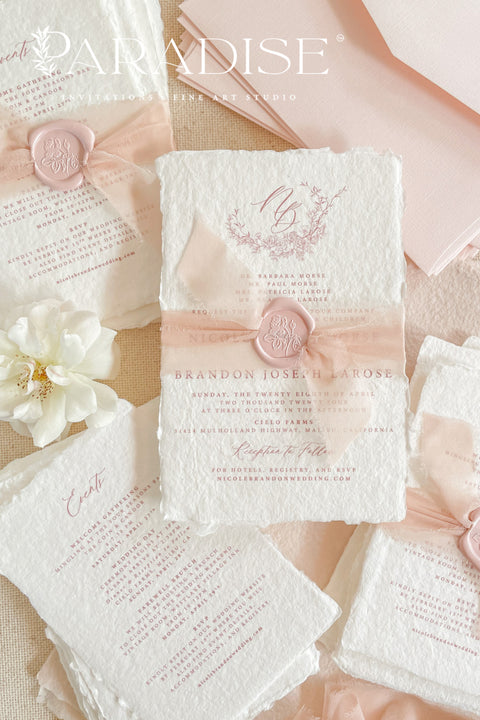 This exquisite wedding invitations suite offers a perfect blend of natural texture and personalized elegance. Each invite is a beautiful work of art, featuring a delicate floral invites design and a custom monogram created just for you. Printed on luxurious handmade paper with a romantic deckle edge, these pretty invites are a tactile and beautiful preview of your special day.