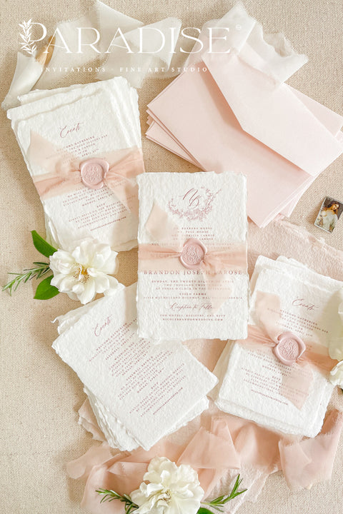 This exquisite wedding invitations suite offers a perfect blend of natural texture and personalized elegance. Each invite is a beautiful work of art, featuring a delicate floral invites design and a custom monogram created just for you. Printed on luxurious handmade paper with a romantic deckle edge, these pretty invites are a tactile and beautiful preview of your special day.