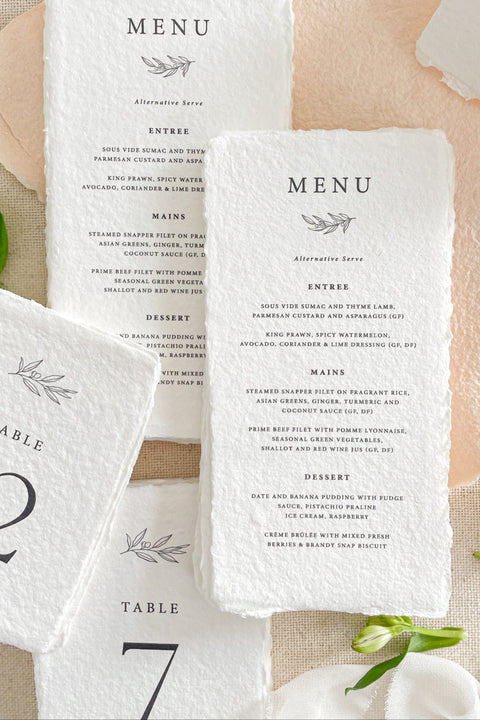 Set the tone for your reception with our luxury handmade paper wedding menus, crafted from premium 100% cotton rag paper and finished with naturally torn deckled edges. Designed for couples who appreciate refined details and timeless artistry, each menu is hand-pressed and printed using archival inks to ensure every piece feels like a work of art. These menus can be fully customized with your menu wording, monogram, and ink color.