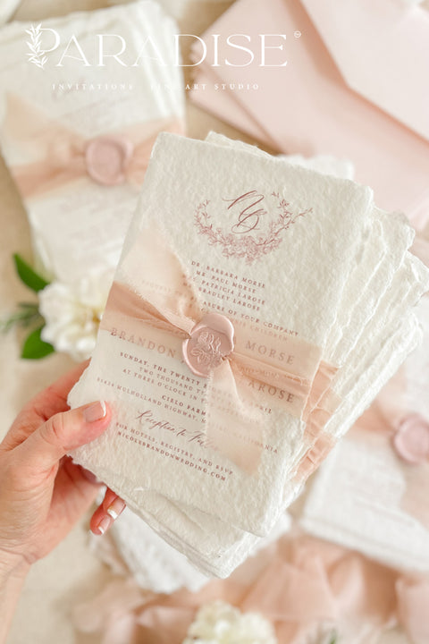 This exquisite wedding invitations suite offers a perfect blend of natural texture and personalized elegance. Each invite is a beautiful work of art, featuring a delicate floral invites design and a custom monogram created just for you. Printed on luxurious handmade paper with a romantic deckle edge, these pretty invites are a tactile and beautiful preview of your special day.