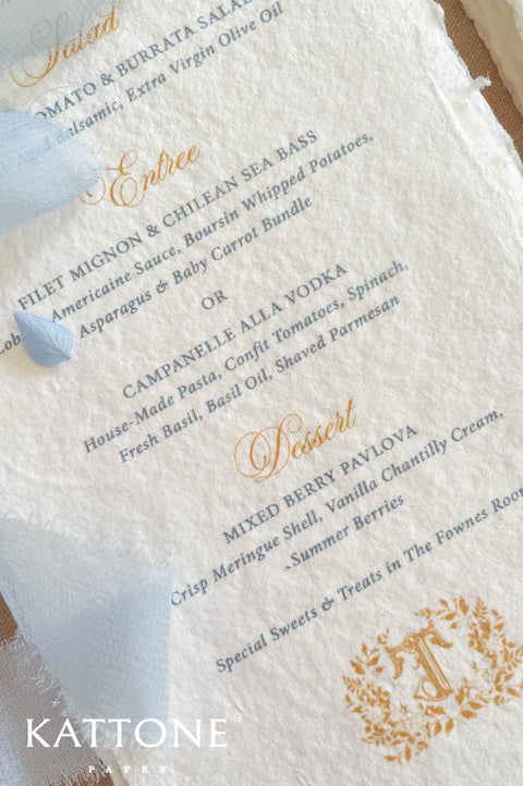 Luxury wedding menu stationery featuring gold script headings paired with refined blue serif typography for timeless sophistication.