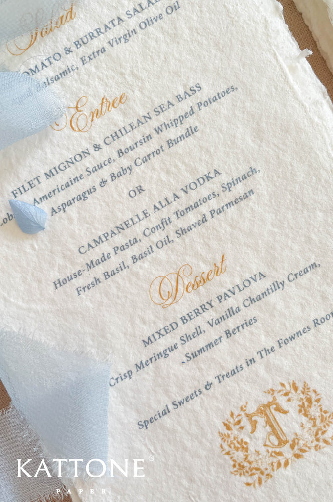 Luxury wedding menu stationery featuring gold script headings paired with refined blue serif typography for timeless sophistication.