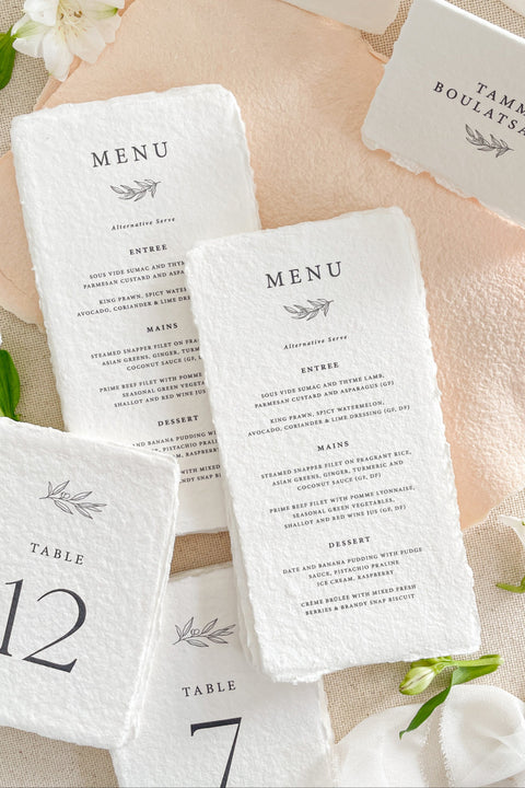 Set the tone for your reception with our luxury handmade paper wedding menus, crafted from premium 100% cotton rag paper and finished with naturally torn deckled edges. Designed for couples who appreciate refined details and timeless artistry, each menu is hand-pressed and printed using archival inks to ensure every piece feels like a work of art. These menus can be fully customized with your menu wording, monogram, and ink color.