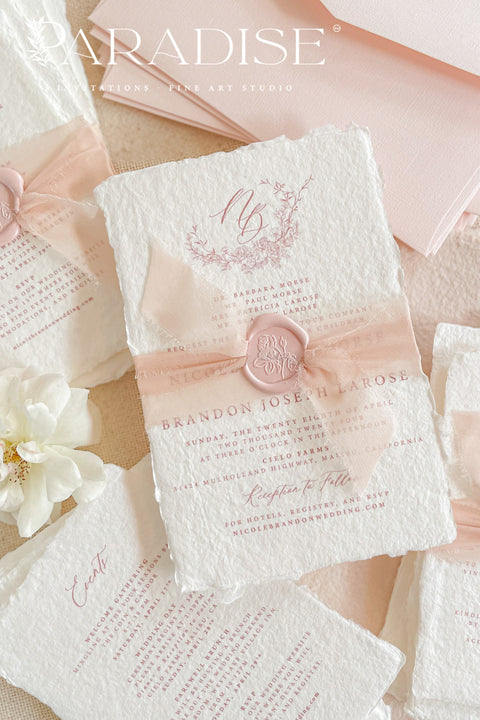 This exquisite wedding invitations suite offers a perfect blend of natural texture and personalized elegance. Each invite is a beautiful work of art, featuring a delicate floral invites design and a custom monogram created just for you. Printed on luxurious handmade paper with a romantic deckle edge, these pretty invites are a tactile and beautiful preview of your special day.
